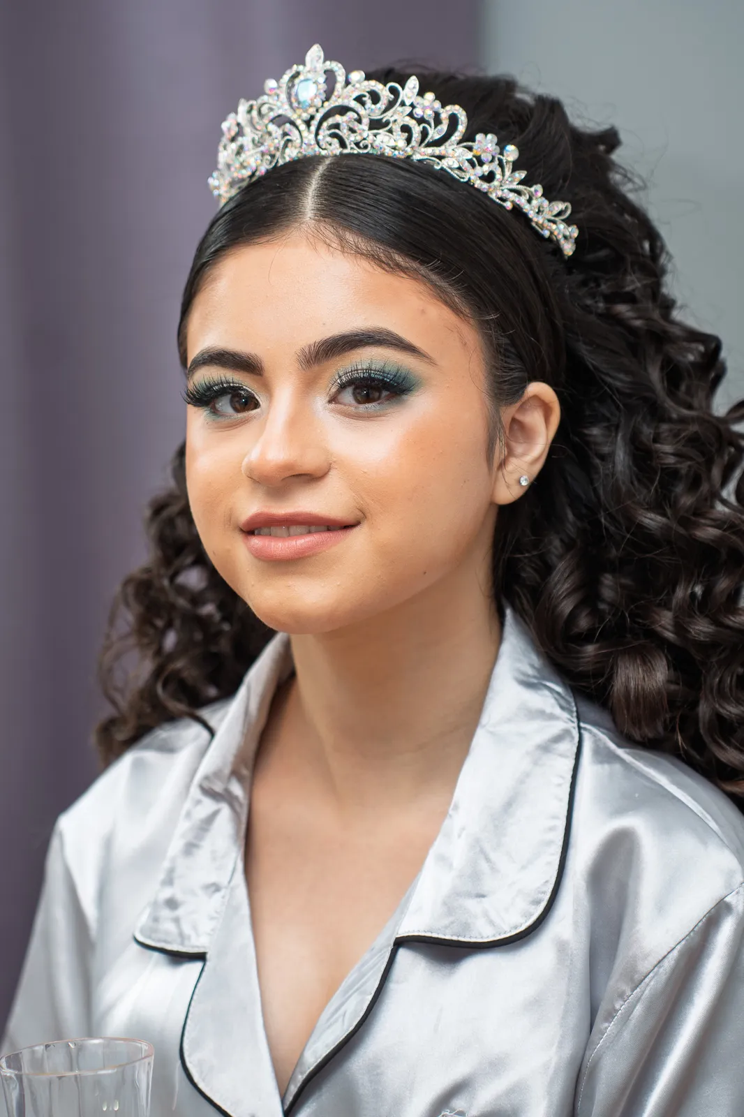 Quinceañera getting ready in her tiara