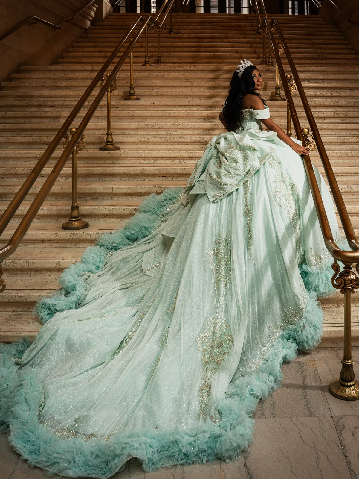 Quinceañera gown train on a marble staircase